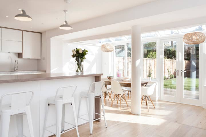 white kitchen with table and chairs