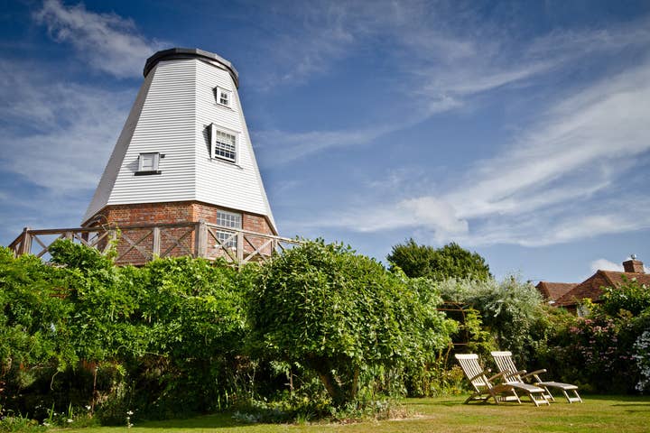 windmill behind trees